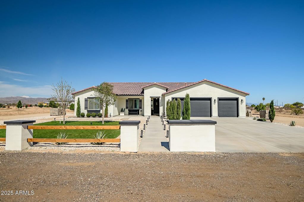 19. Ranch Home with Crimson Sunset Facade and Grecian Columns