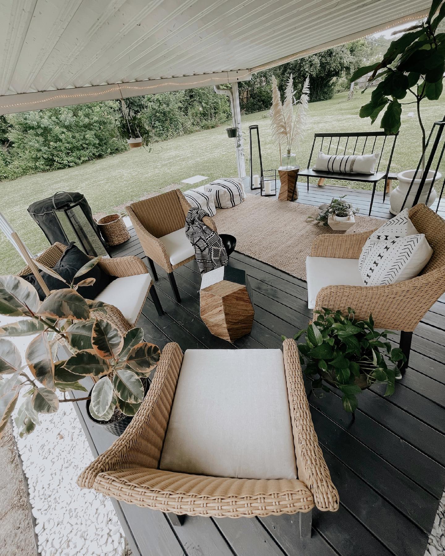 20. a Mosaic Of River Stones and Terracotta Pots Under a Weathered Pergola