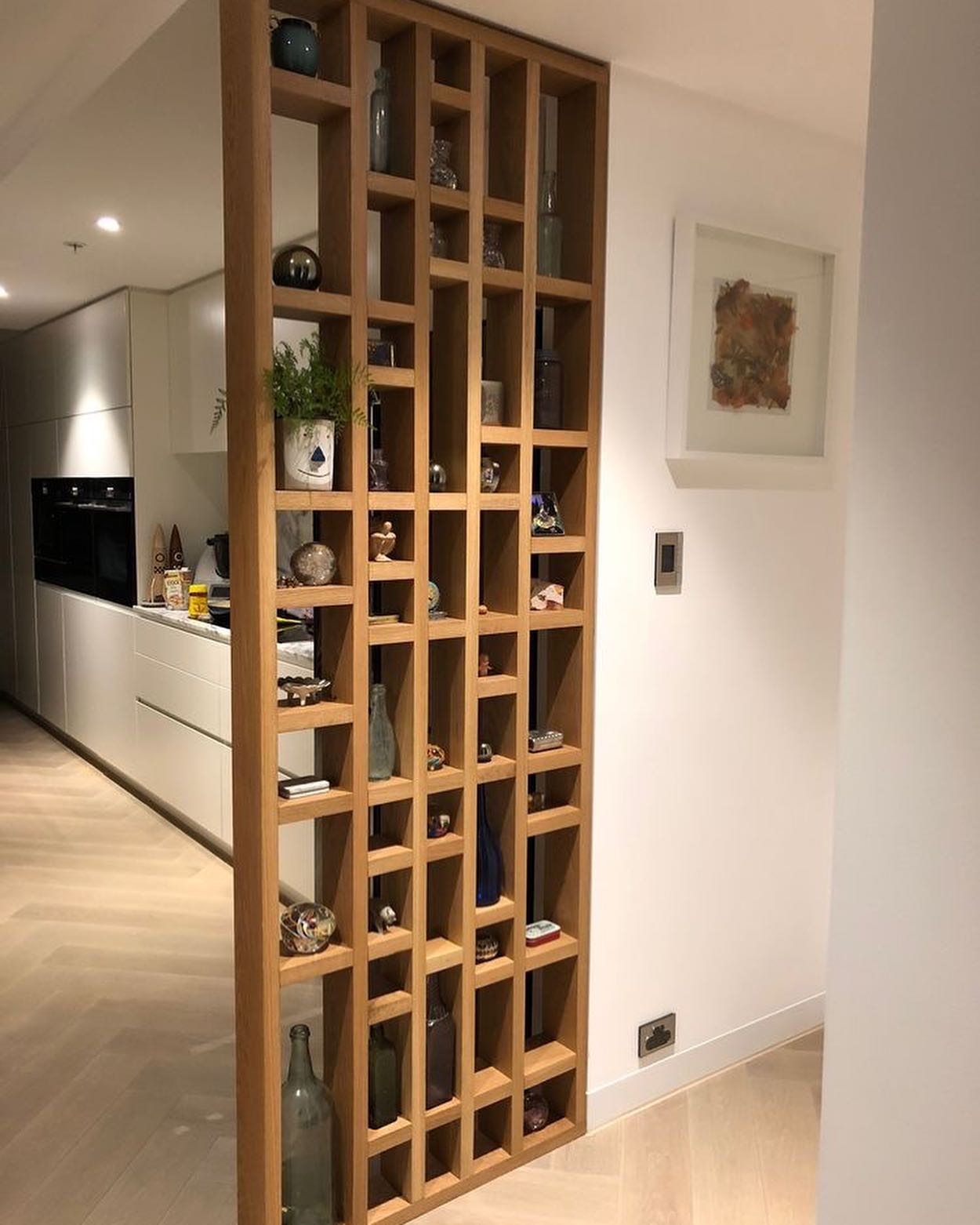 11. Glossy White Gloss Kitchen Partition with Geometric Glass Inserts