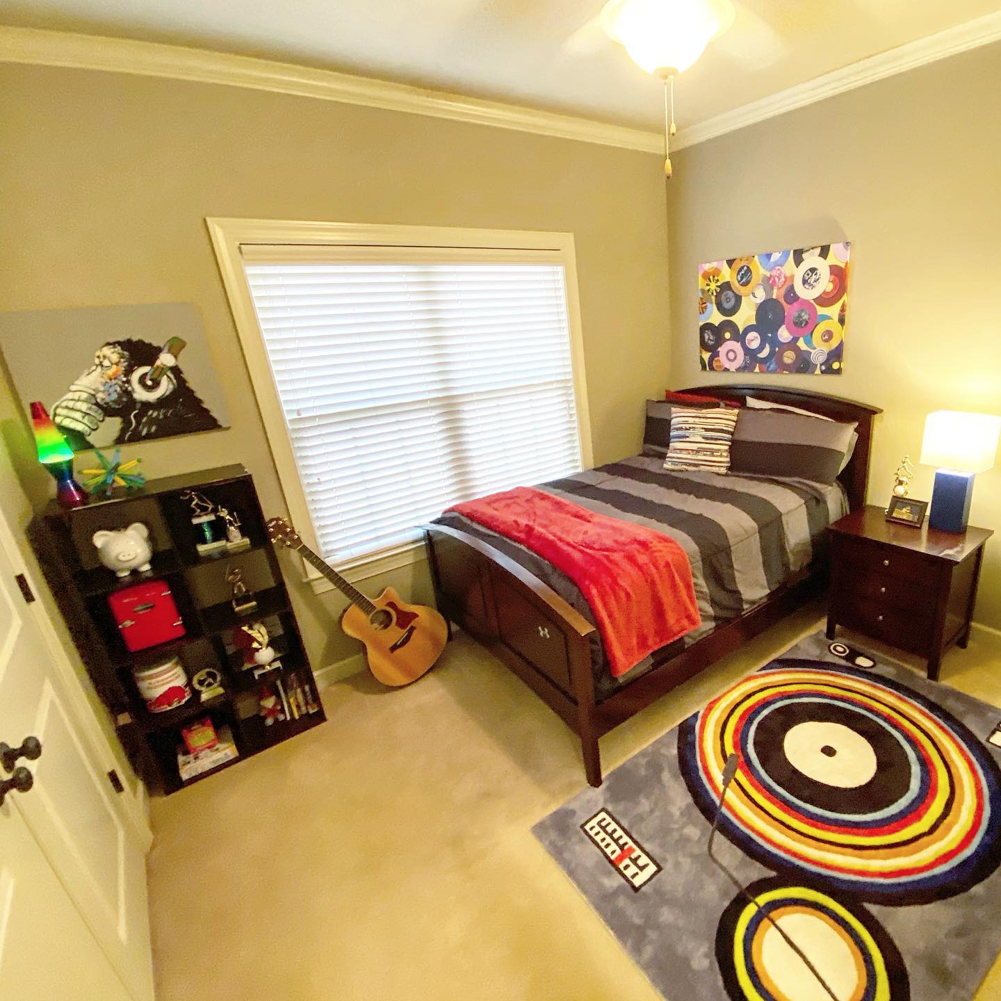 7. a Skateboard Suspended Above a Bed with Geometric Wall Art