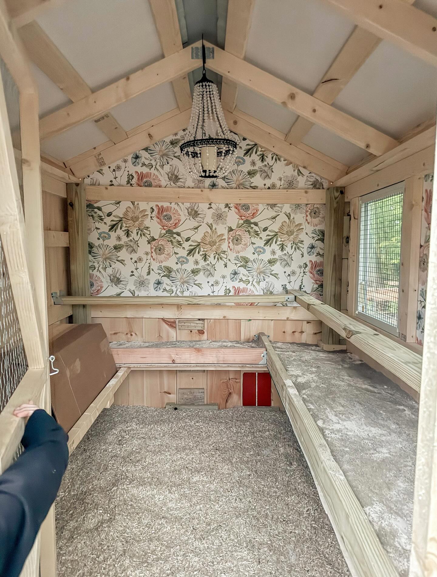 17. a Triangular Perch with a Circular Escape Hatch In a Rustic Coop