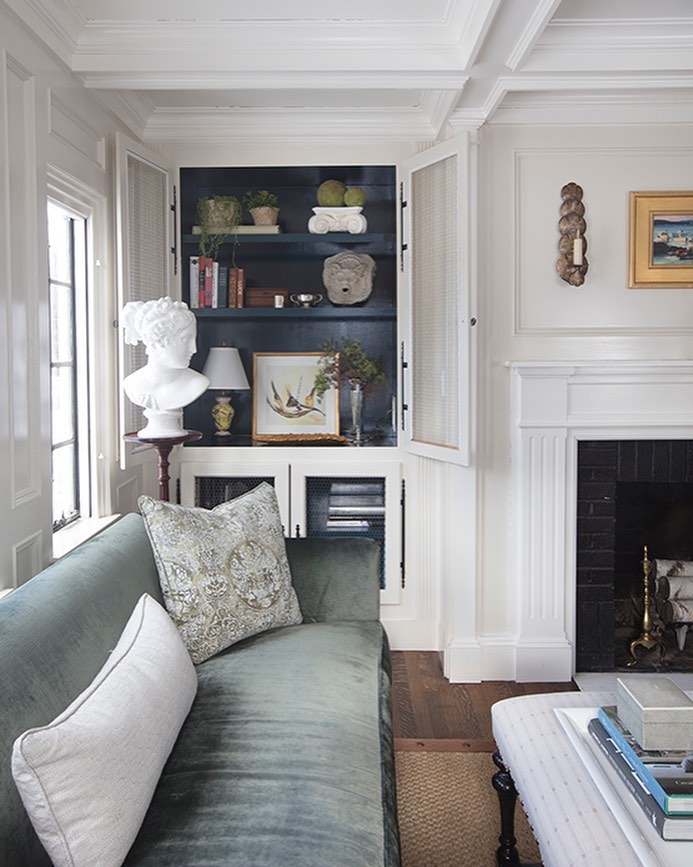 11. Vibrant Geometric Shelves with Eclectic Book Arrangement