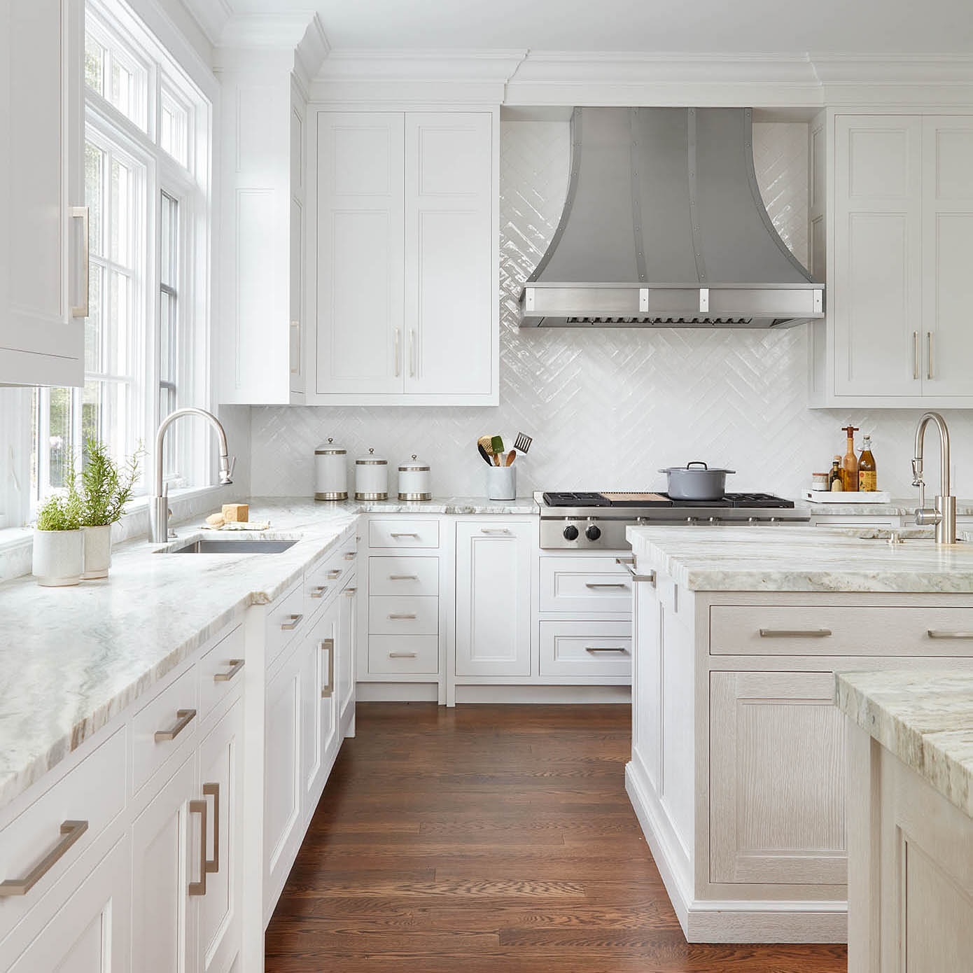 9. White Mosaic Medallion and Subway Tile Fusion In a Compact Kitchen