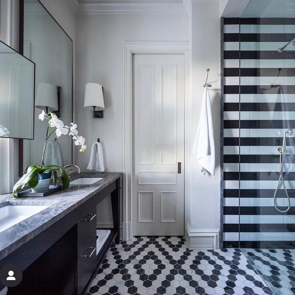31. Moonlit Mosaic Tiles and Vintage Brass Fixtures Define This Monochrome Retreat