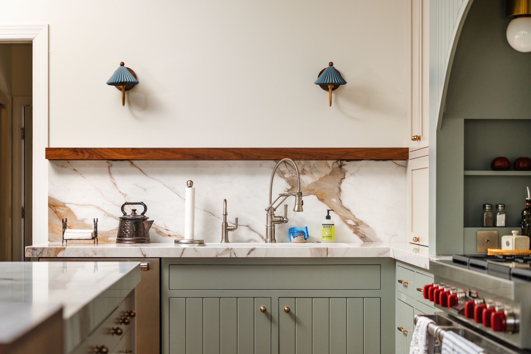 3. a Ceramic Swan Neck Faucet Over a Rustic Wooden Shelf with Amber Glass Jars