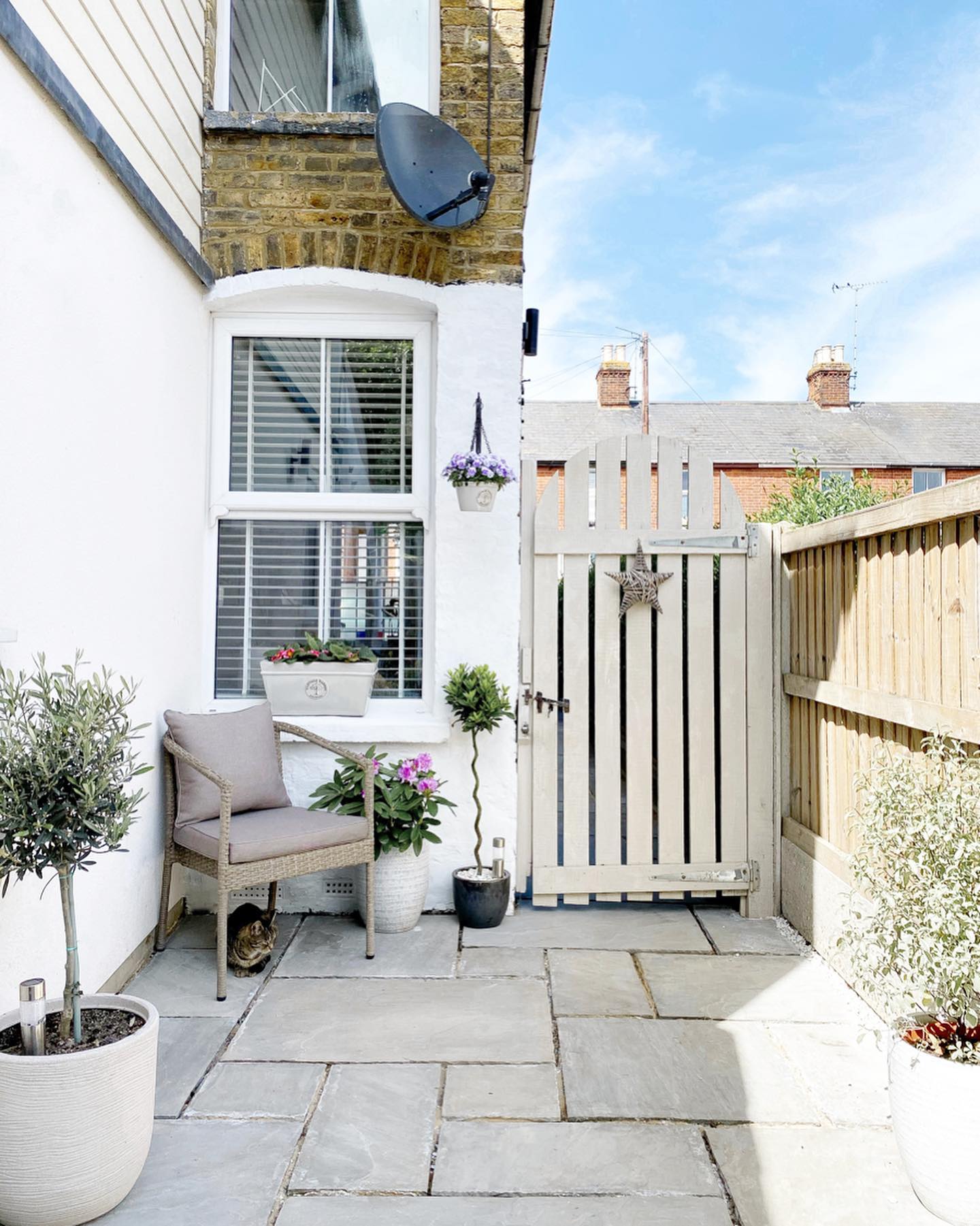 12. a Sunlit Retreat with a Repurposed Pallet Coffee Table and Tire Planters