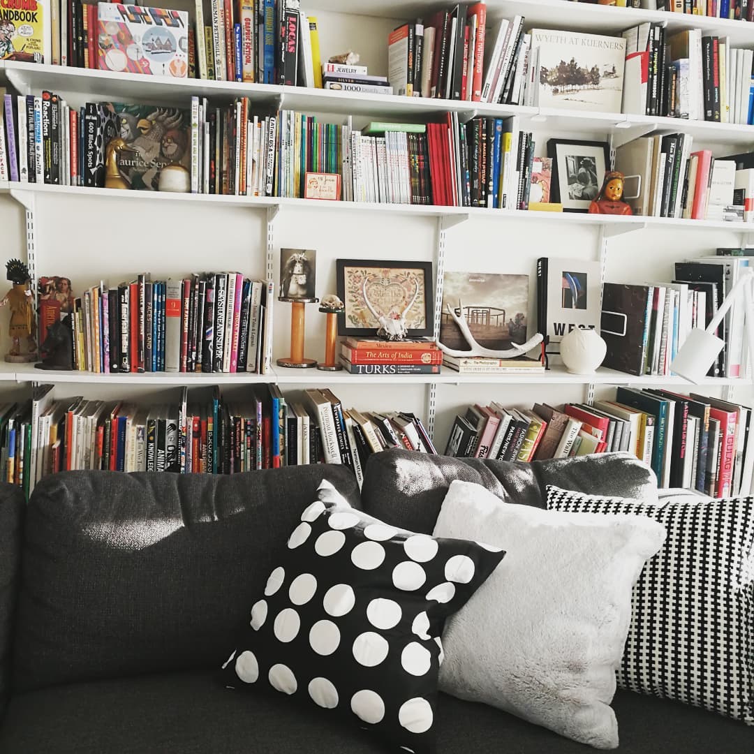10. Bookshelf Arranged Like a Musical Score with Colorful Book Spines