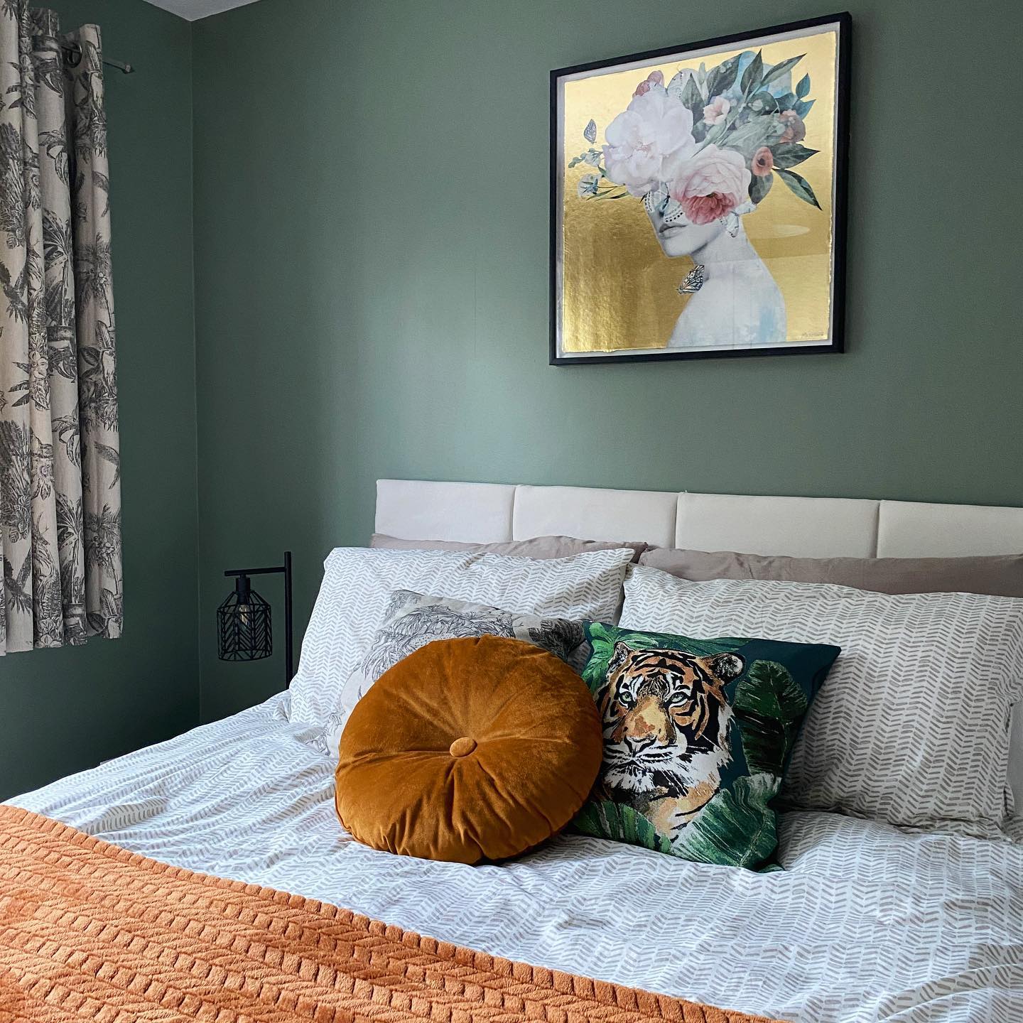 6. Sage Green Waves: a Boho Bedroom with Woven Wall Art and Macrame Plant Hangers