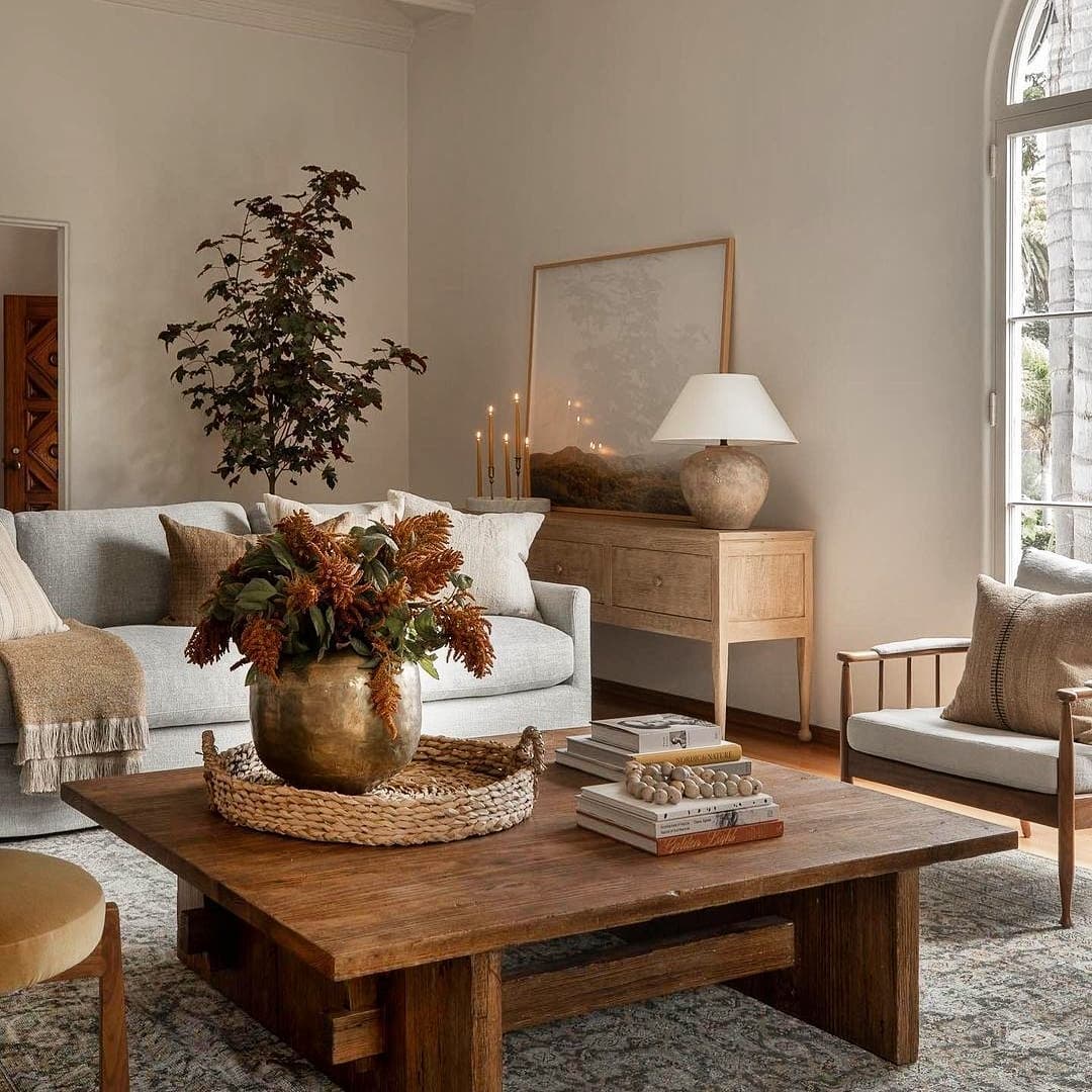 4. Fall's Whimsical Woodland Retreat: Mossy Greens and Glowing Pumpkins on a Rustic Mantel