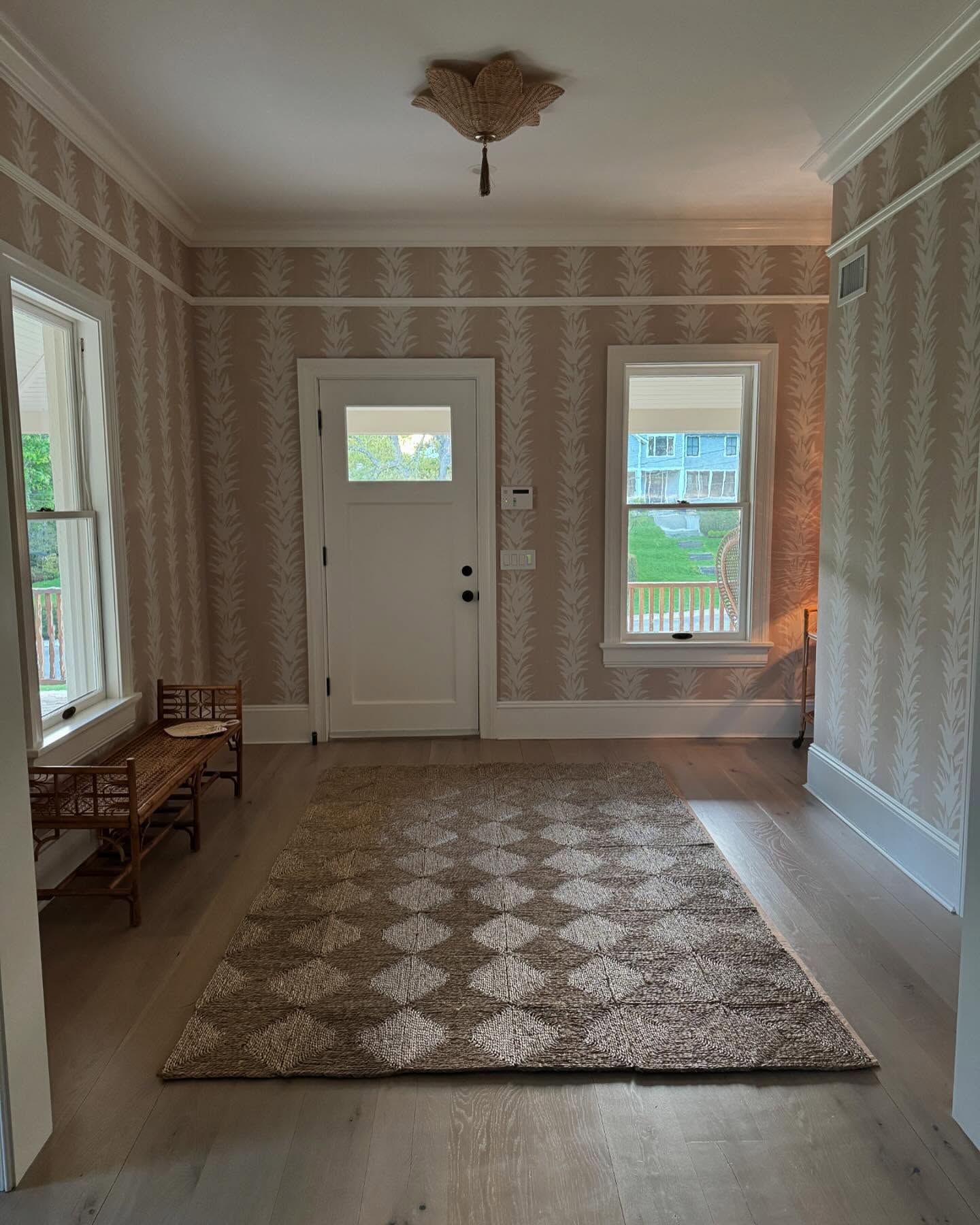17. Crimson Velvet Curtains Frame a Geometric Console In Sunlit Foyer