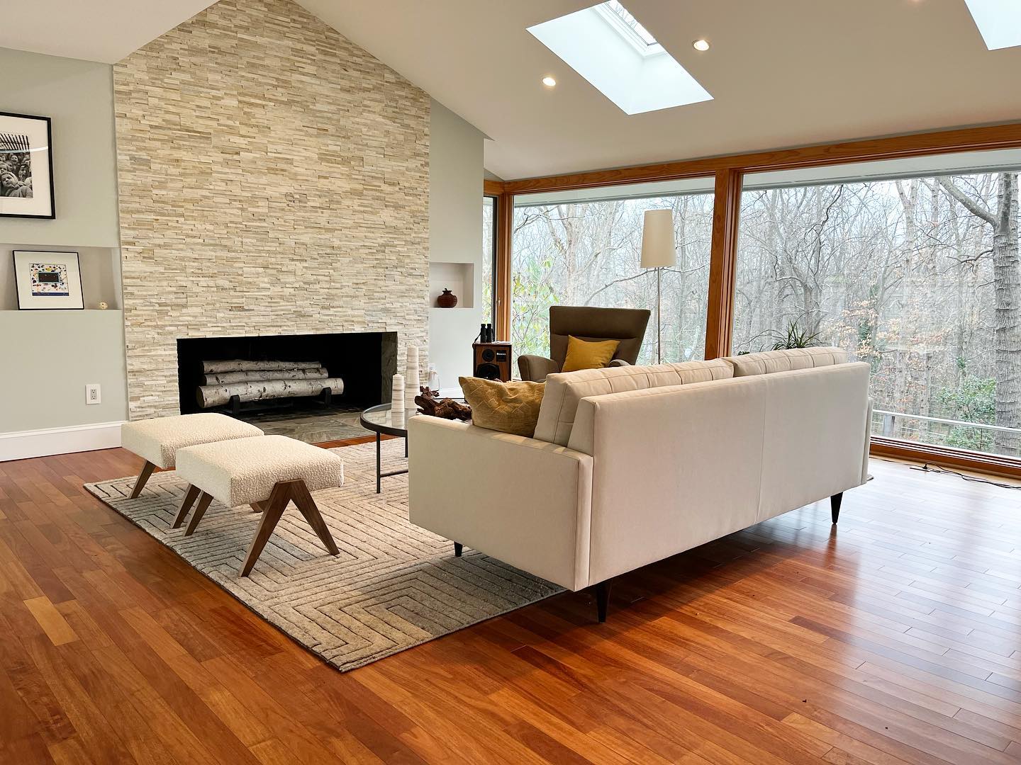 3. Mid-century Geometric Patterns Meet Warm Wood Tones In a Sunlit Living Space