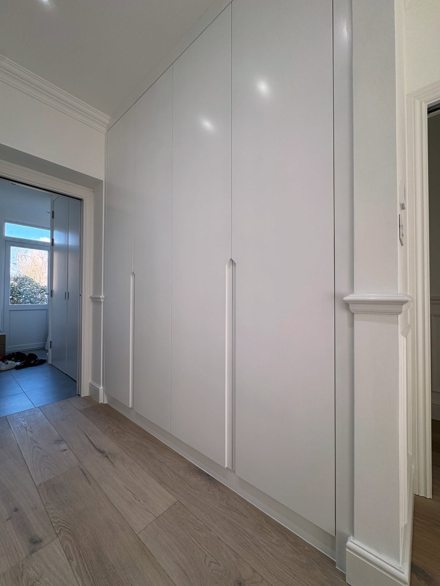 15. the Convergence Of Teal and Timber: a Wardrobe with Geometric Glass Accents