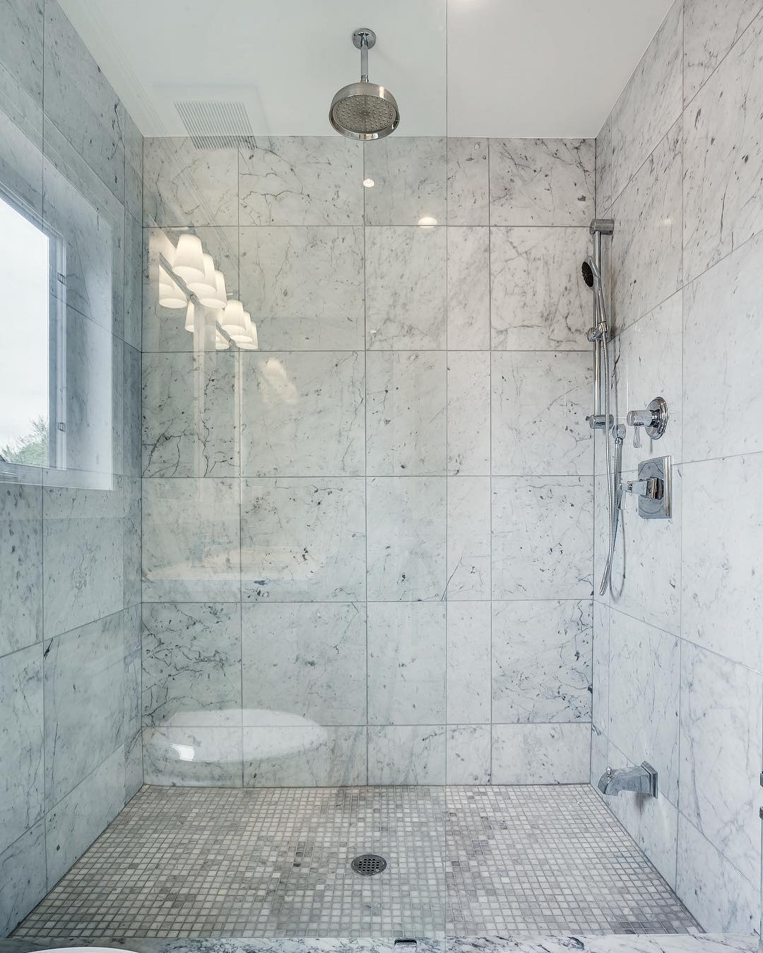2. Moonlit Marble Cascade: a Shower Niche with a Circular Accent