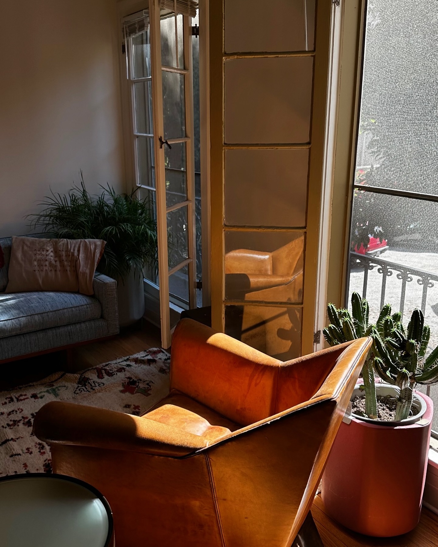 10. Mid-century Maple and Teal Geometric Harmony Living Room