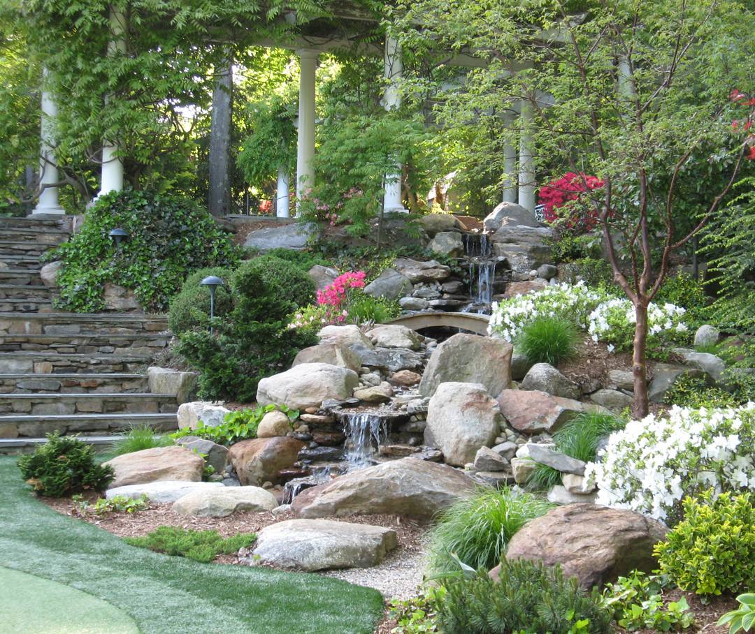 21. a Moss-covered Boulder Cascade with Delicate Ferns and Miniature Orchids