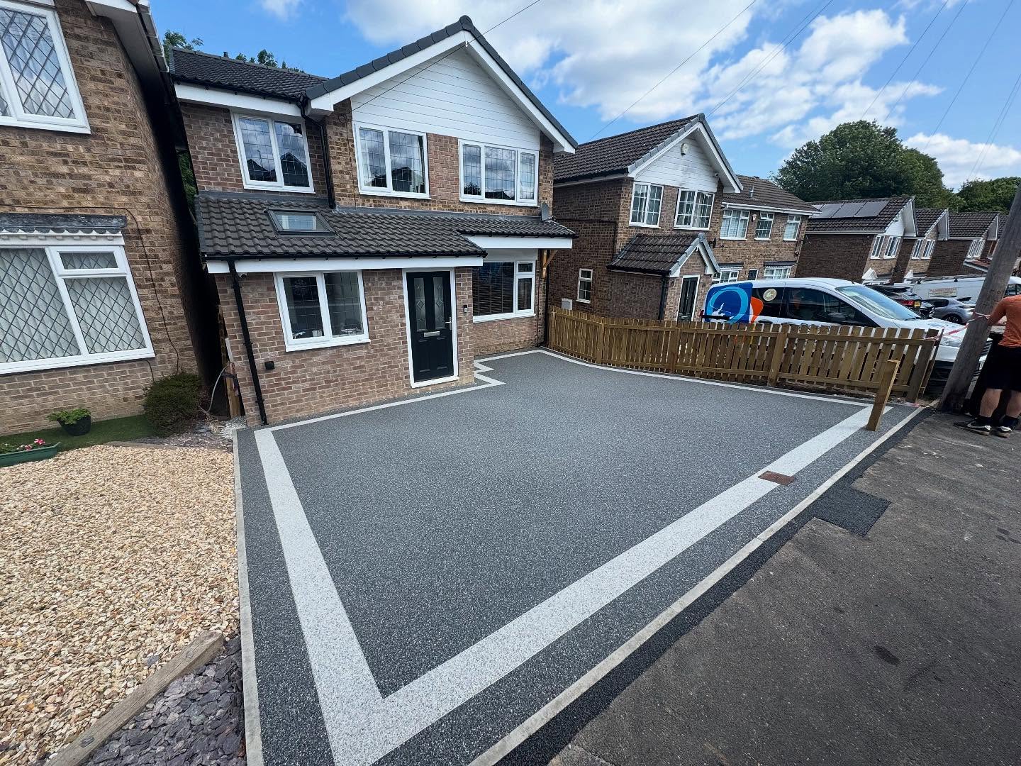 7. Cobblestone Pathway with Lanterns and Potted Palms Amidst Lush Greenery