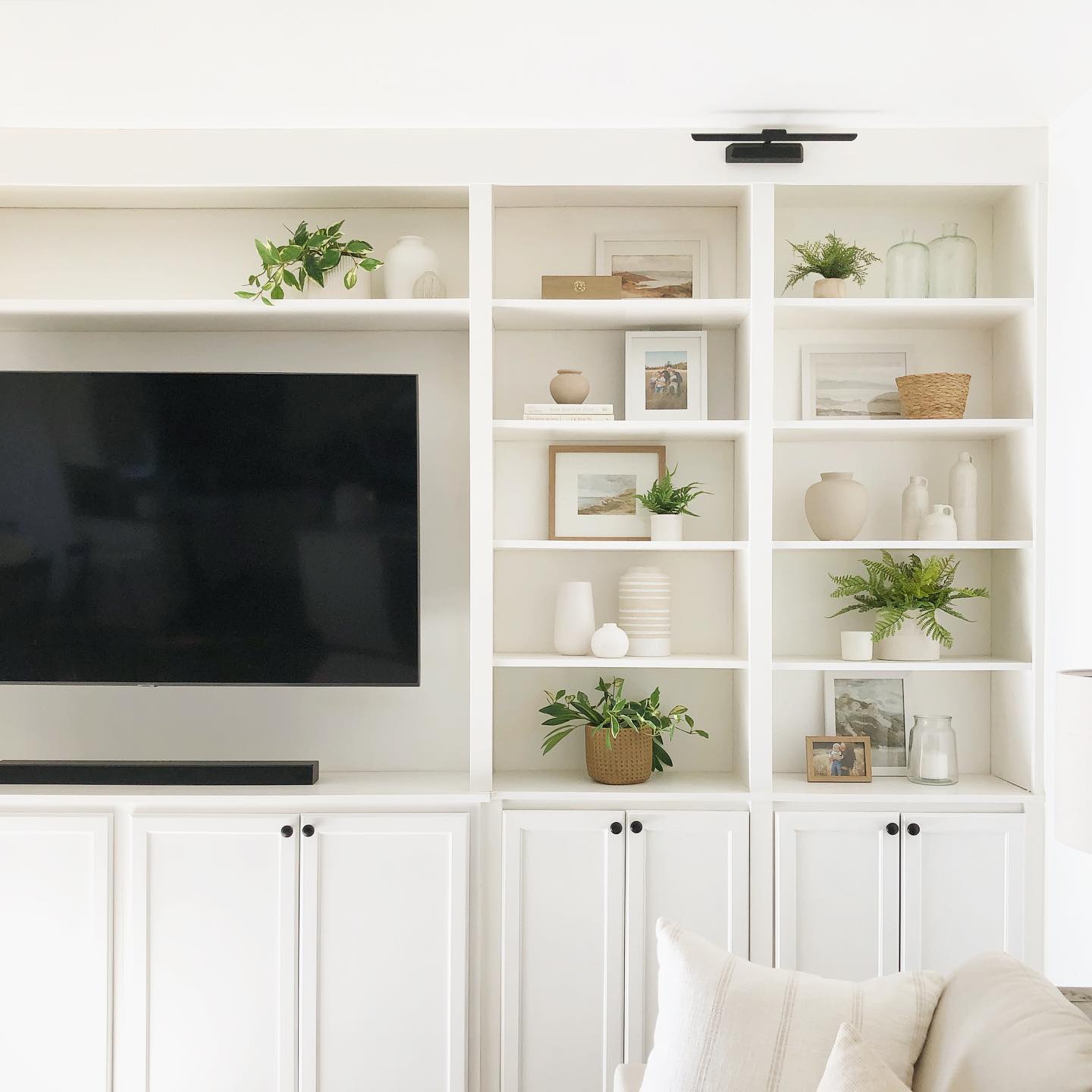 4. Velvet Ribboned Vintage Tv Stand with Eclectic Art Trio