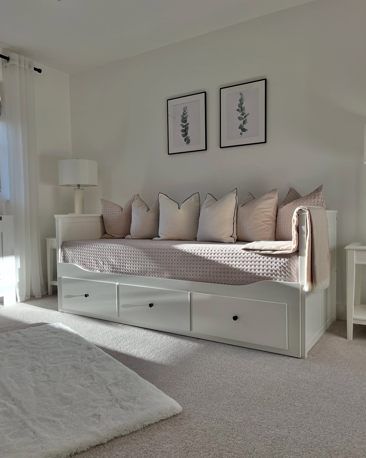 20. Sunlit Serenity with Woven Rattan and Potted Plants Daybed Nook