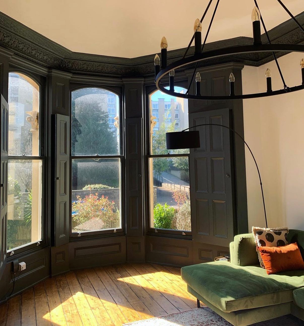 10. Golden Sunlight Filtering Through Sheer White Curtains Onto a Cozy Reading Nook