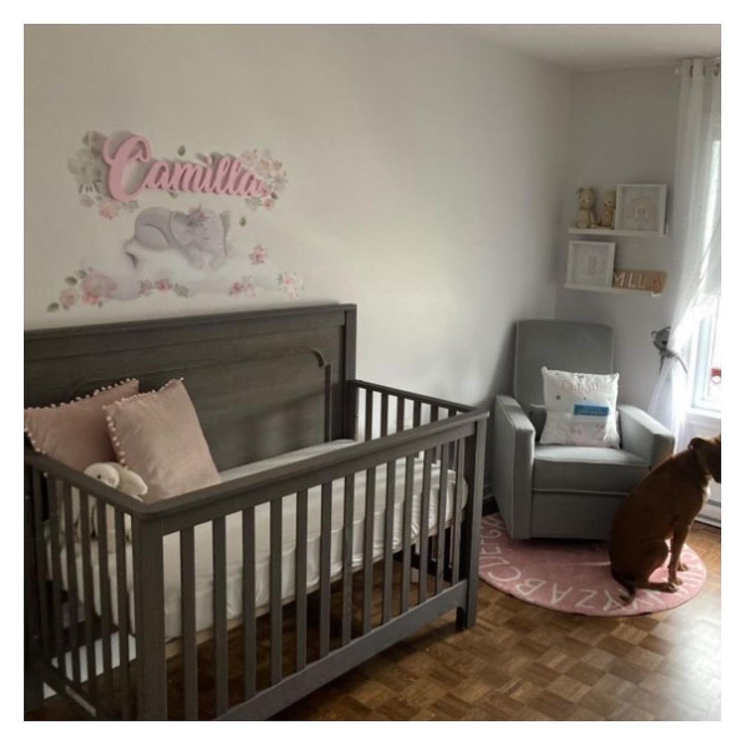 15. Soft Waves Of Serenity: a Nursery with Curved Wooden Cradle and Minimalist Pastels