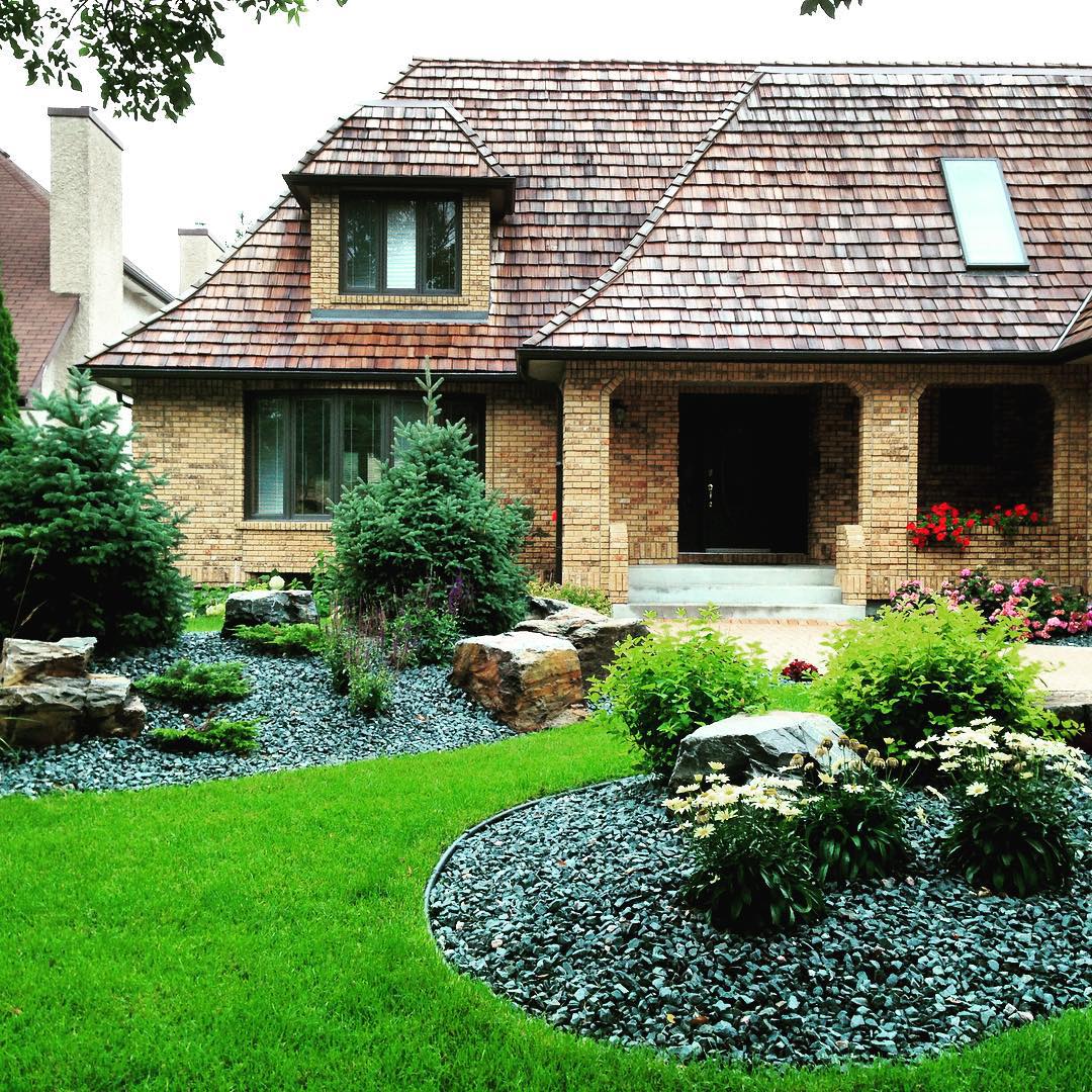 23. Spiraling Greenery and Terracotta Harmony: a Front Yard Reimagined