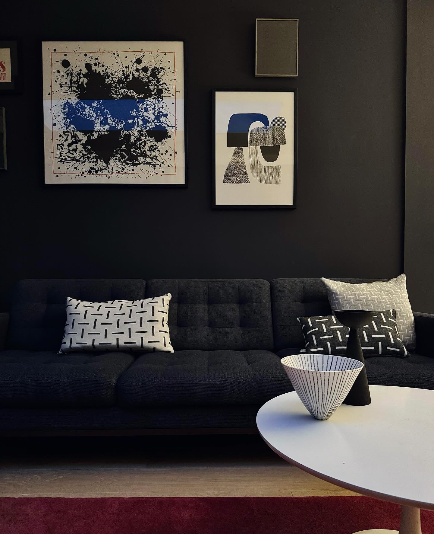 14. Mid-century Meets Monochrome: the Floating Sofa and Geometric Wall Art