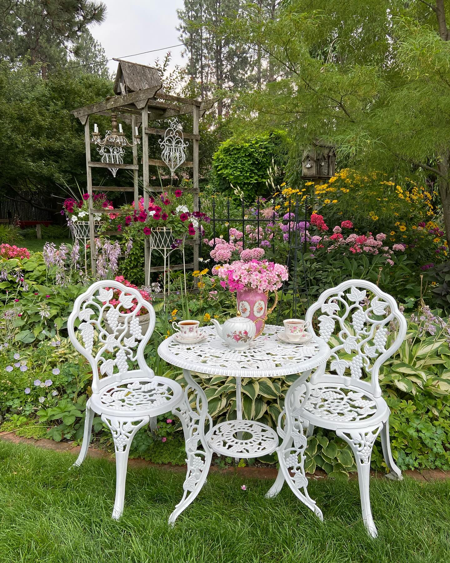 16. a Wicker Archway Framing a Sunlit Stone Path with Lavender Borders