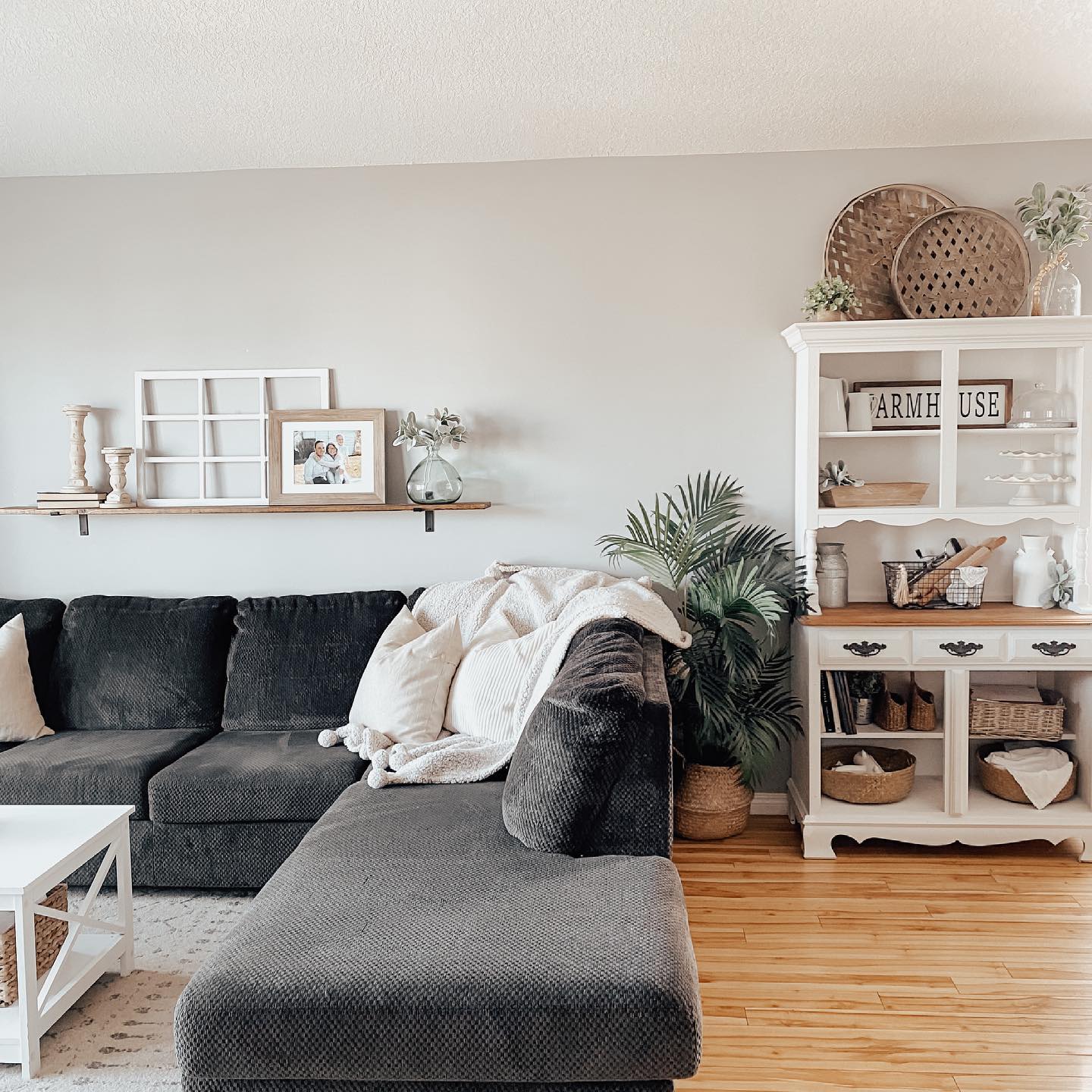 7. Cascading Foliage Over Rustic Wood In Geometric Frames