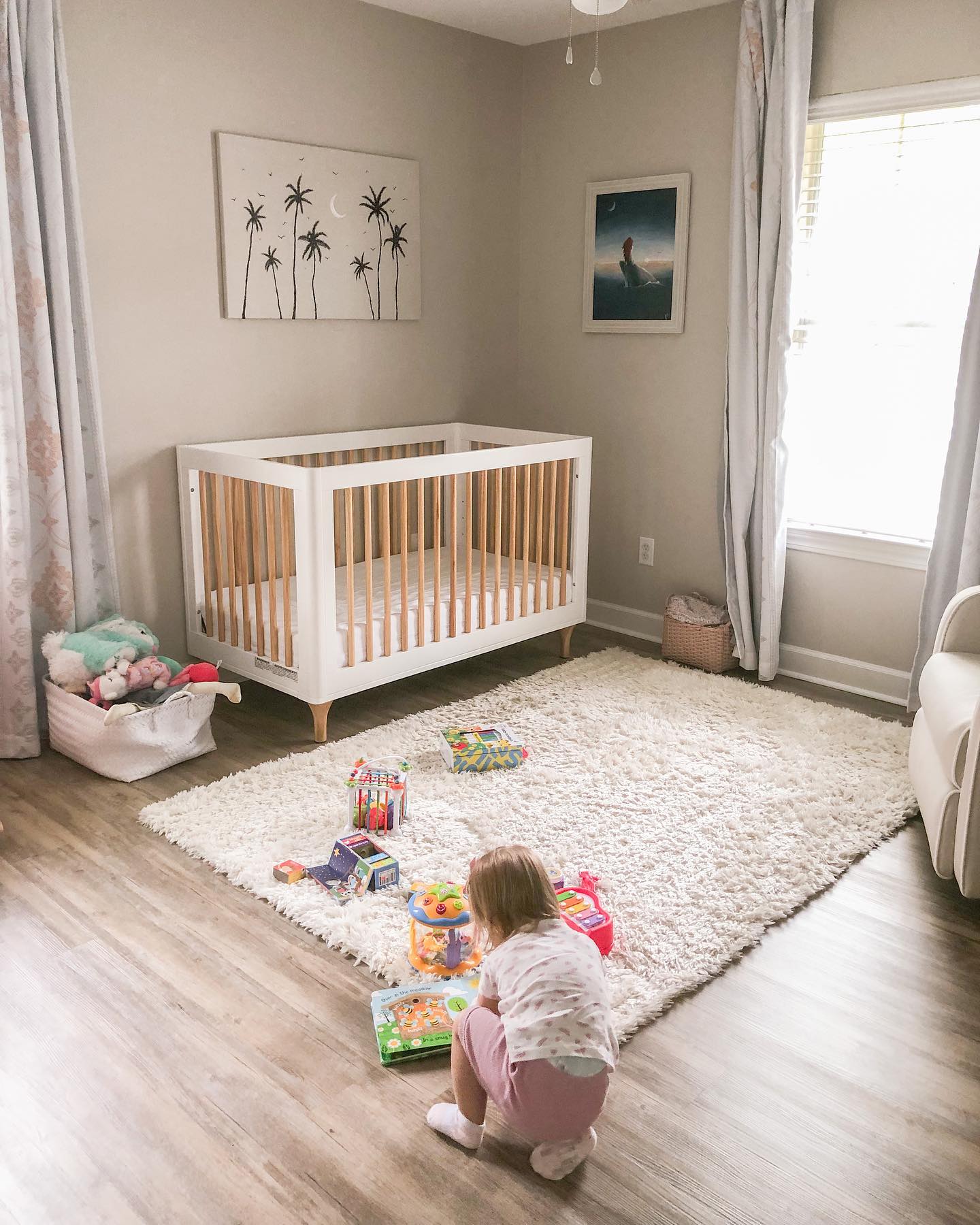 26. a Ballet Slipper Mobile Over a Crib with Polka-dot Blankets