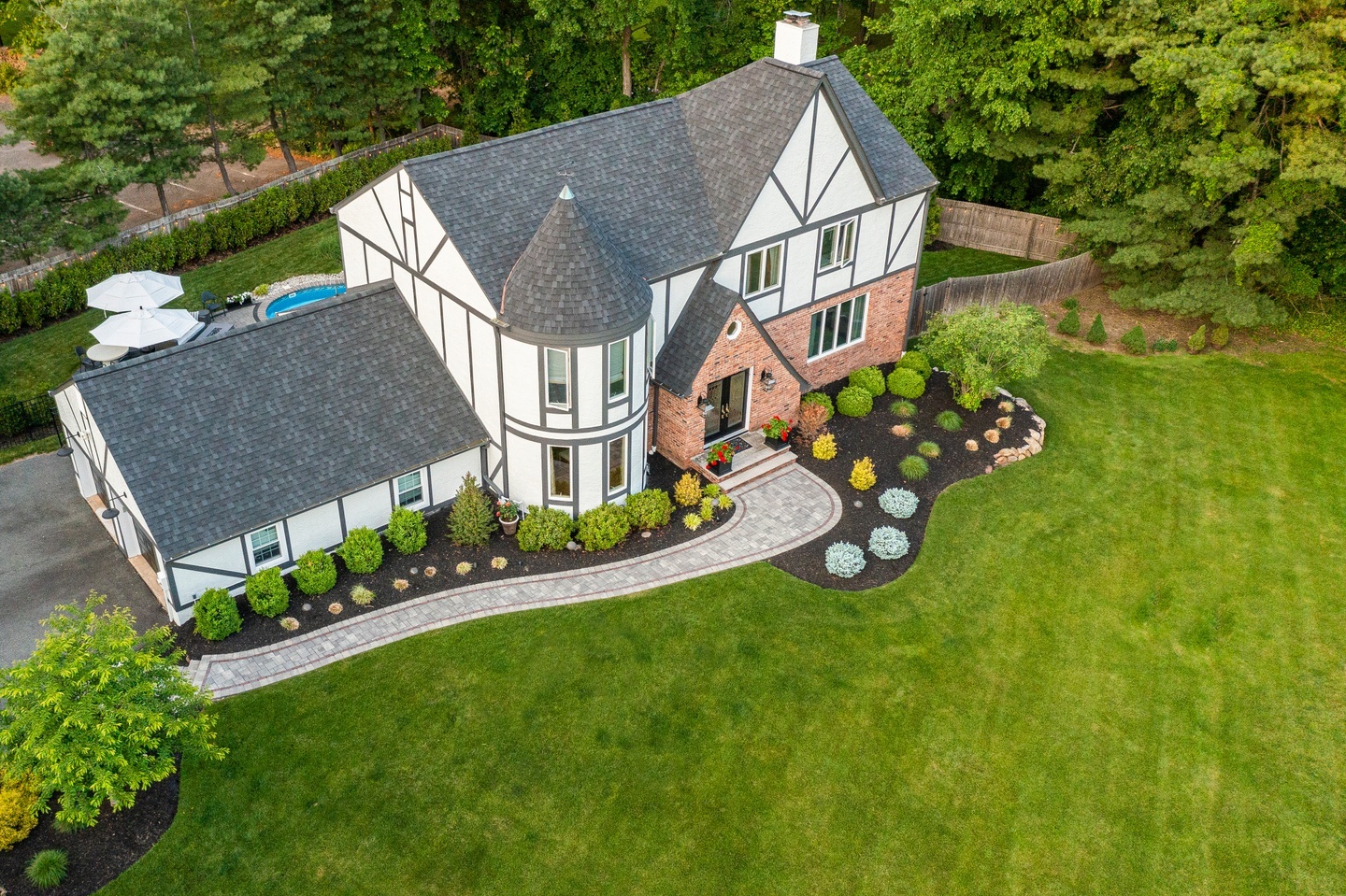 13. Lush Hydrangea Hedge with Sunlit Crimson Roses and Stone Pathway Accents