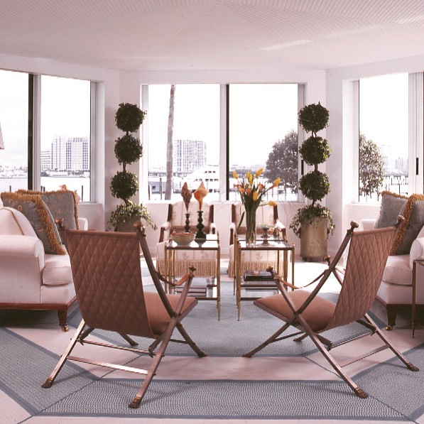 7. the Crimson Velvet Sofa Anchored by Geometric Rugs and Eclectic Art