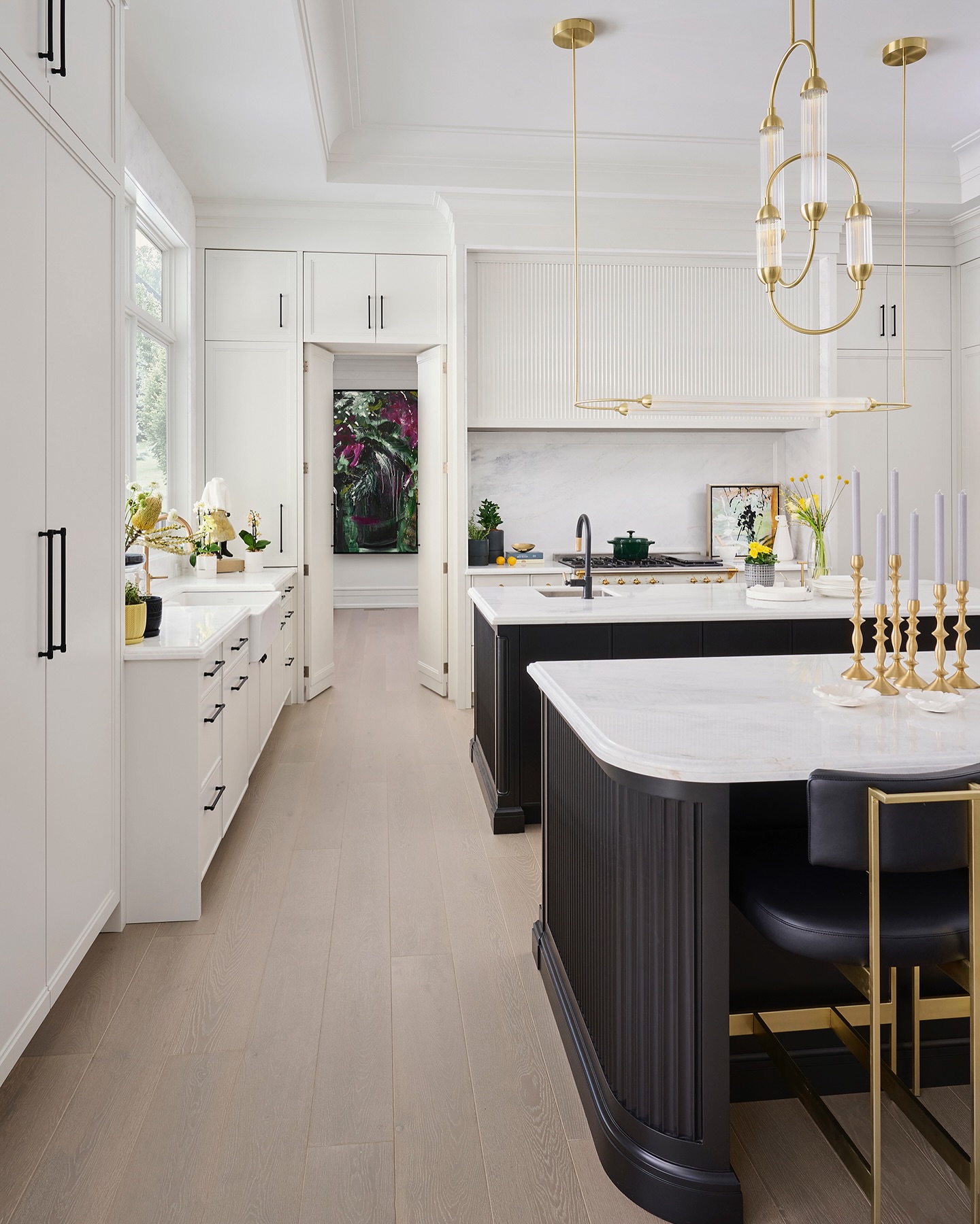 7. Black and White Kitchen with Checkerboard Floor and Industrial Pendant Lights