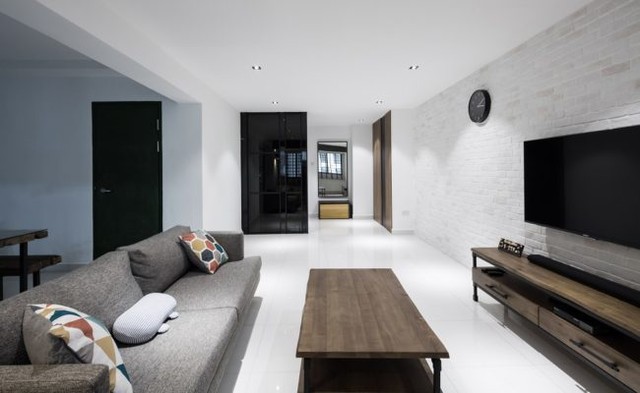 16. Regal Symmetry Meets Cozy Comfort: a Living Room with a Central Fireplace and Dual Seating Arrangement