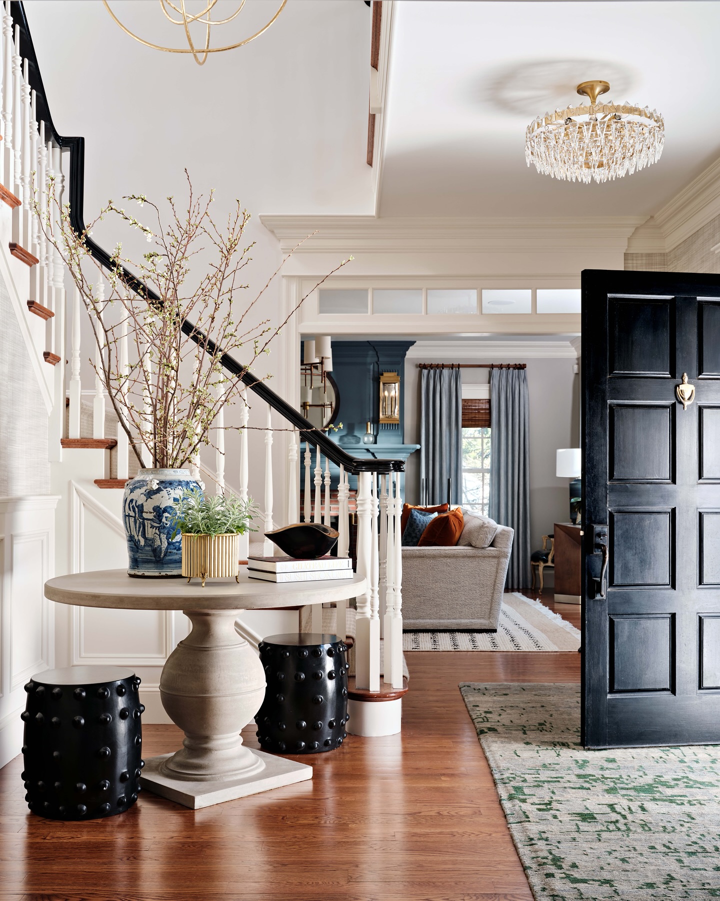 16. a Symphony Of Curves and Light with a Teardrop Chandelier and Oval Mirror