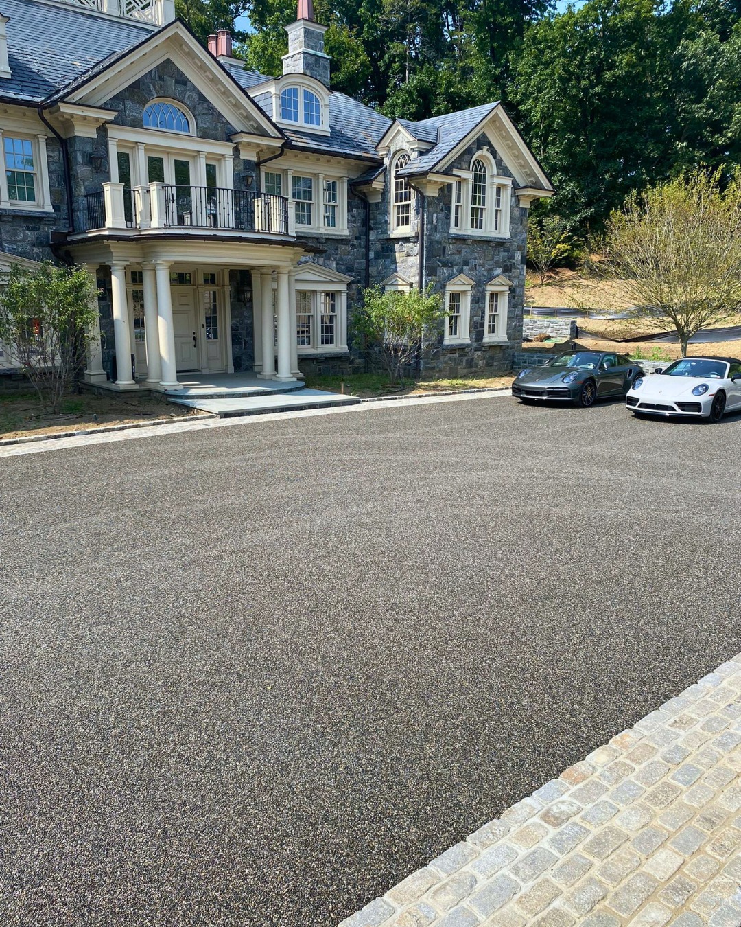 10. Moonlit Driveway: Cobblestone Path with Lanterns and Lush Ferns