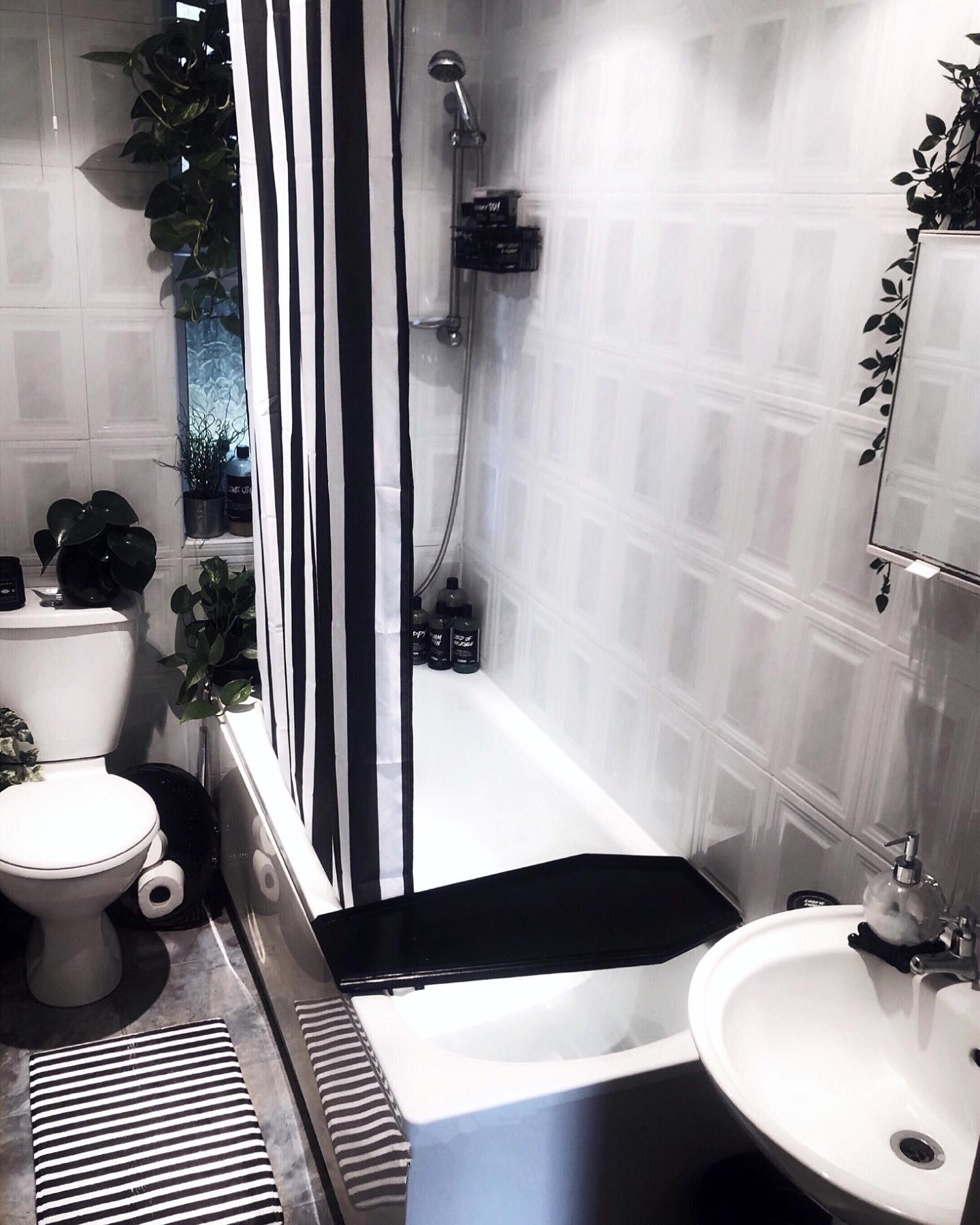 14. Moonlit Spell Reflection: a Bathroom Sink with a Cauldron-shaped Basin and Glowing Orb Light