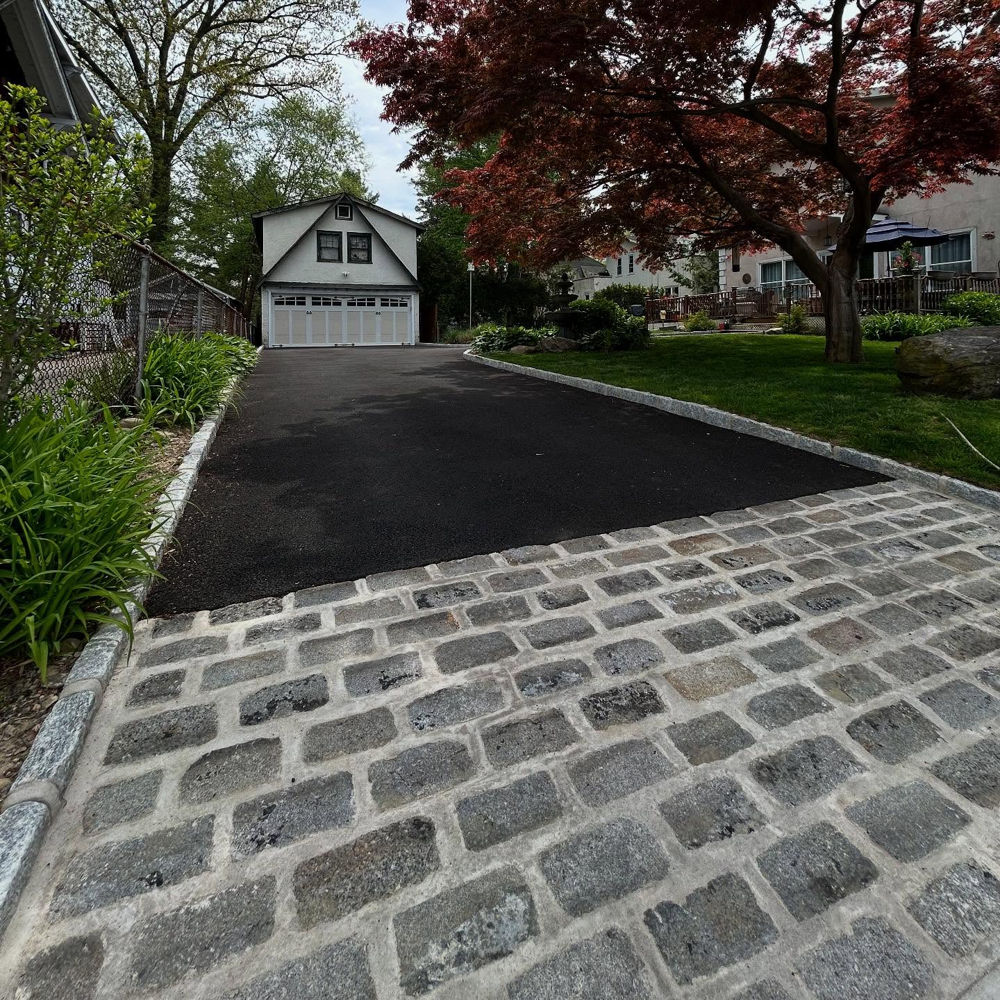 16. Cobblestone Pathway with Lush Fern Border and Lantern Accents