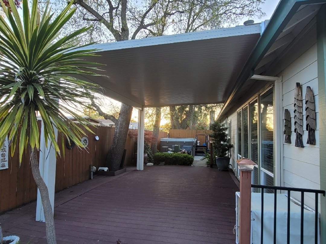 17. Vibrant Blue Adirondack Chairs Overlooking a Budget-friendly Stone Fire Pit