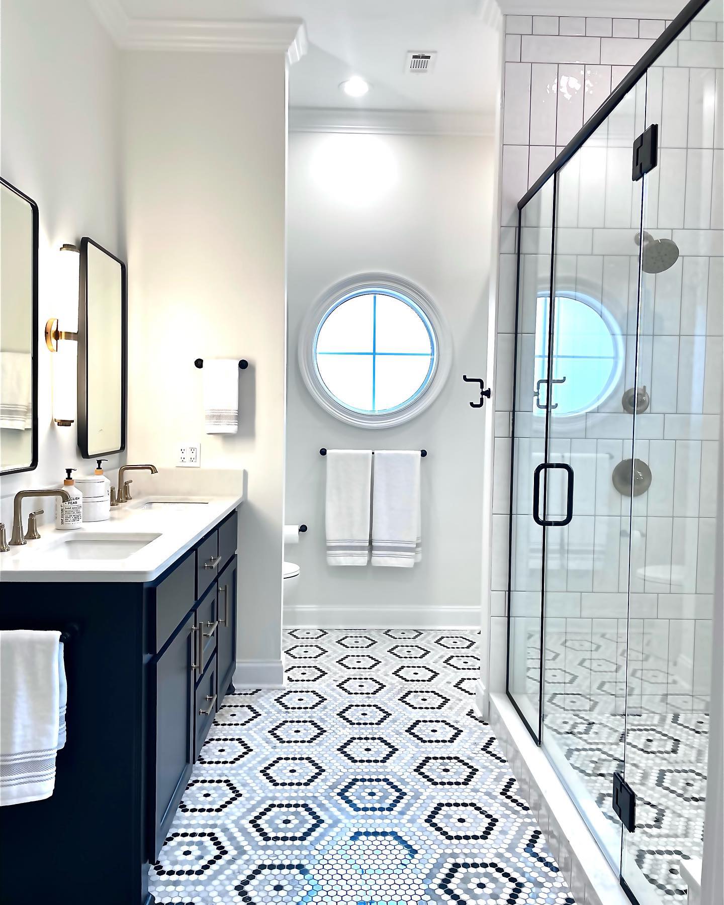 17. Moonlit Marble Mosaic: a Black and White Symphony Of Geometric Tiles and Rounded Sinks