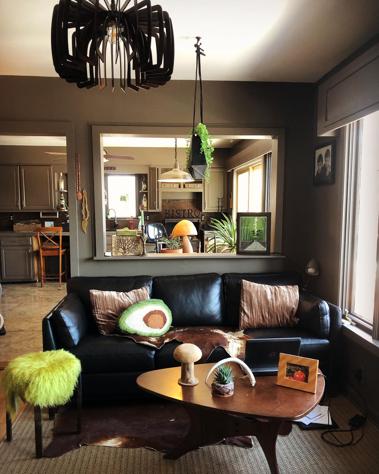 1. Mid-century Modern Living Room with a Suspended Teak Shelf and Geometric Wall Art