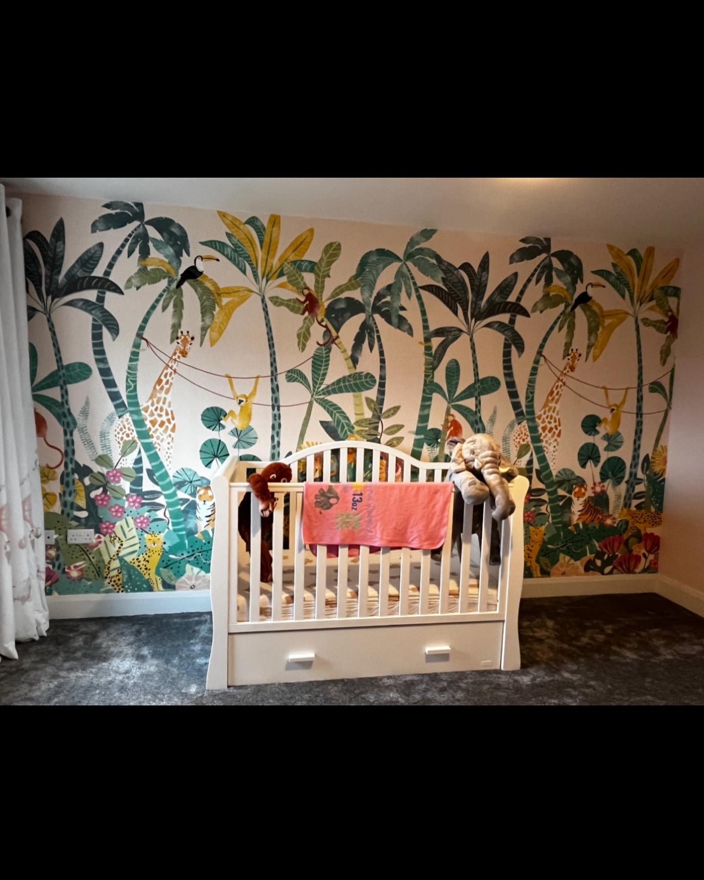 32. Vibrant Rainbow Mobile and Whimsical Cloud Shelves In a Pastel Nursery