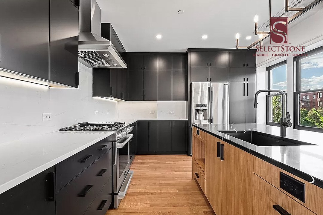 22. Midnight Mosaic: a Monochromatic Kitchen with Hexagonal Backsplash Tiles