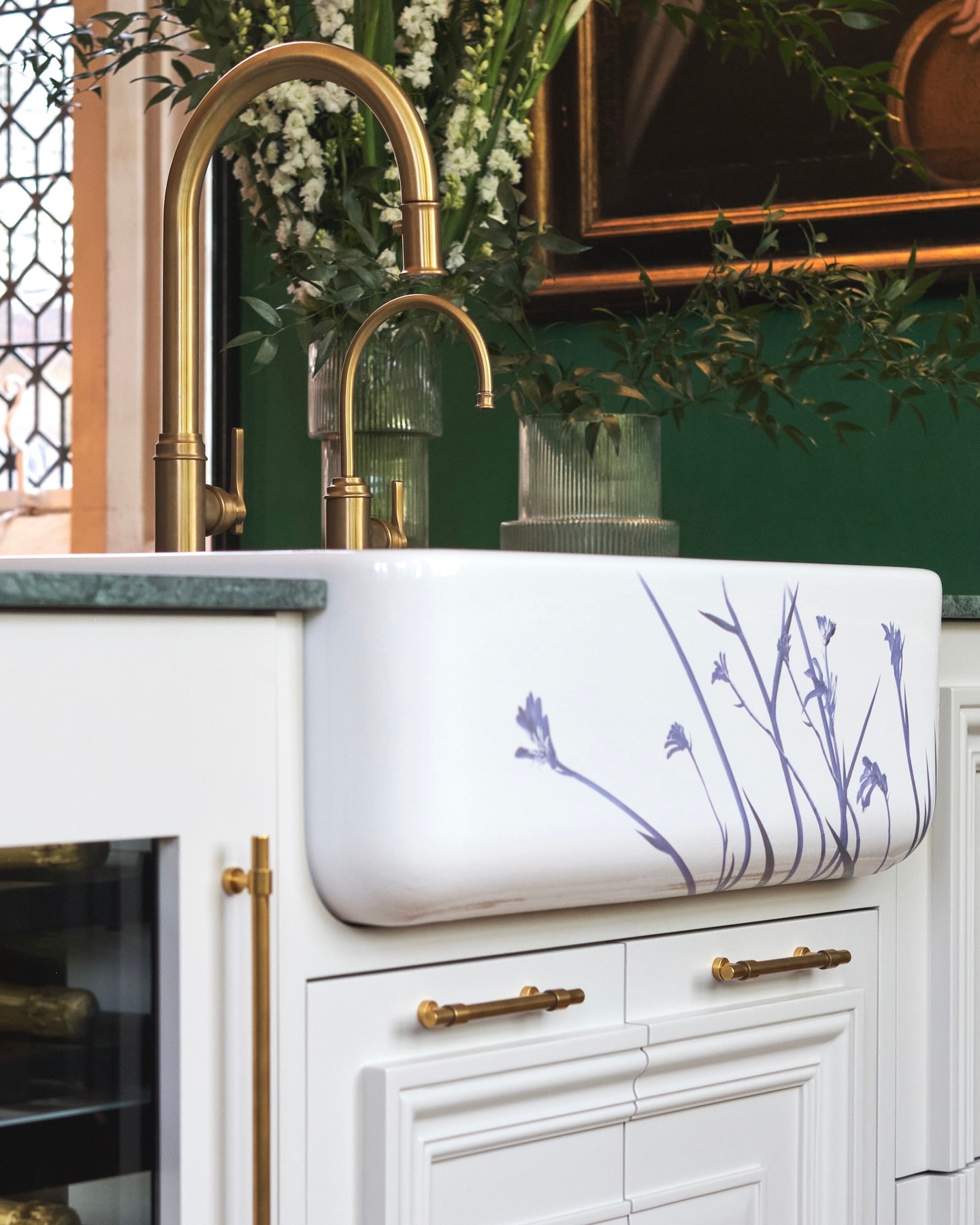 26. a Cascade Of Copper Pans and Basil Greens Over White Subway Tiles