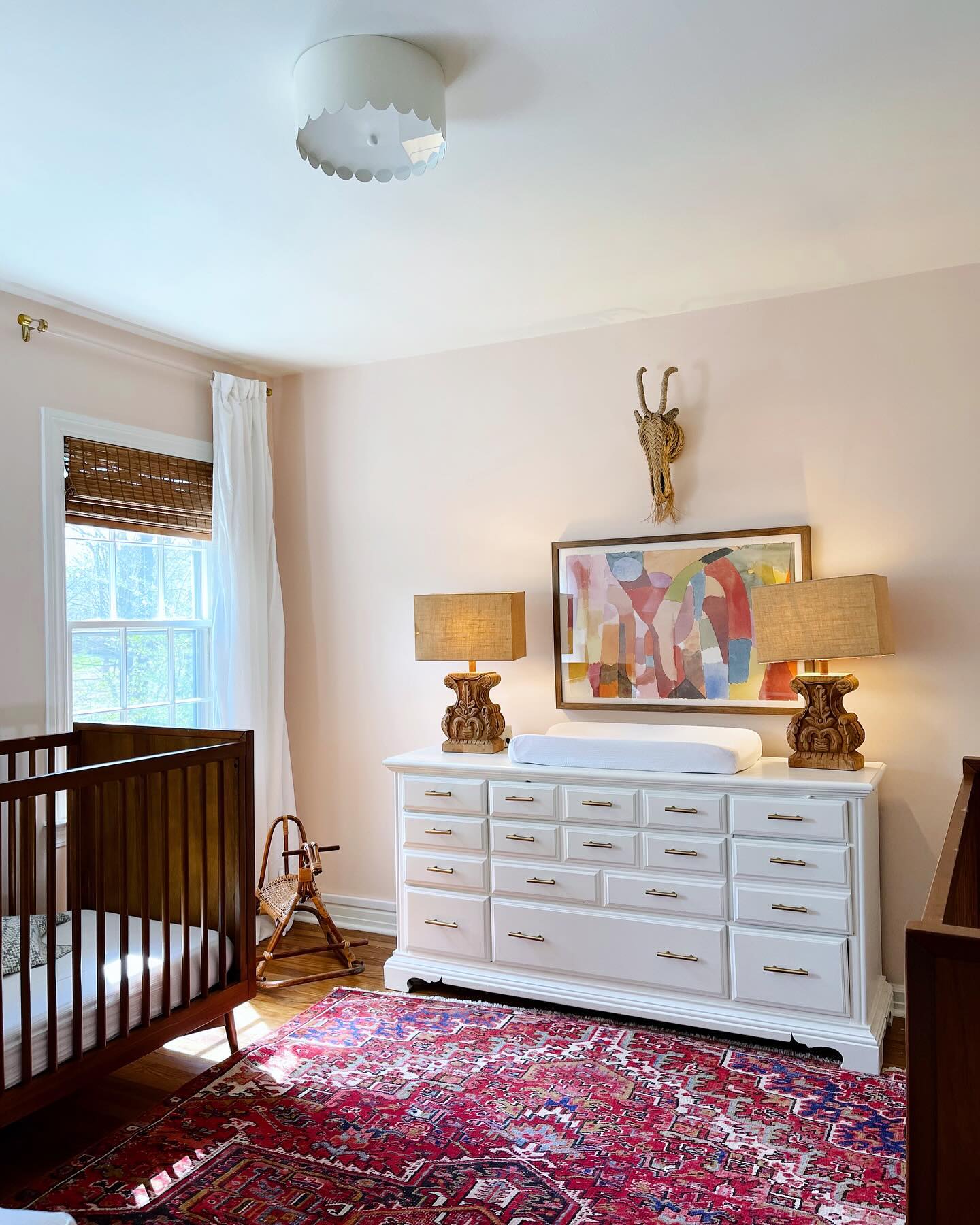 6. Moonlit Meadow Crib with Whimsical Wall Art and Soft Pastel Accents