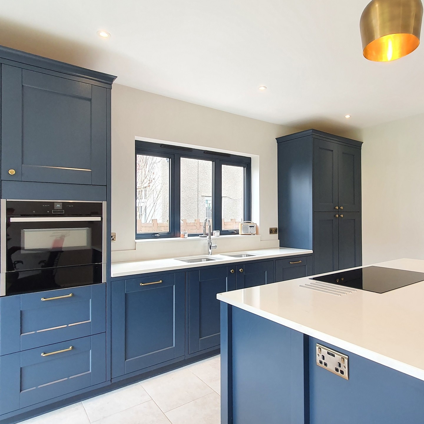 5. Blue Kitchen Symphony: Cobalt Cabinets and Geometric White Tiles In Perfect Harmony