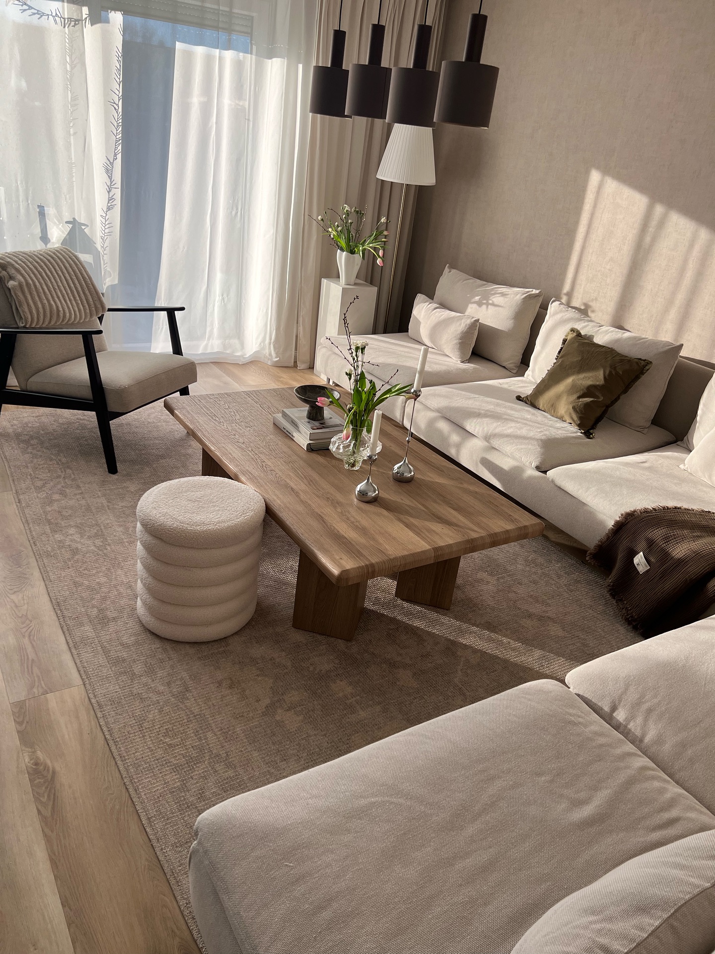 19. Moonlit Serenity: Silver Birch Branches and Frosted Votives on a Glass Coffee Table