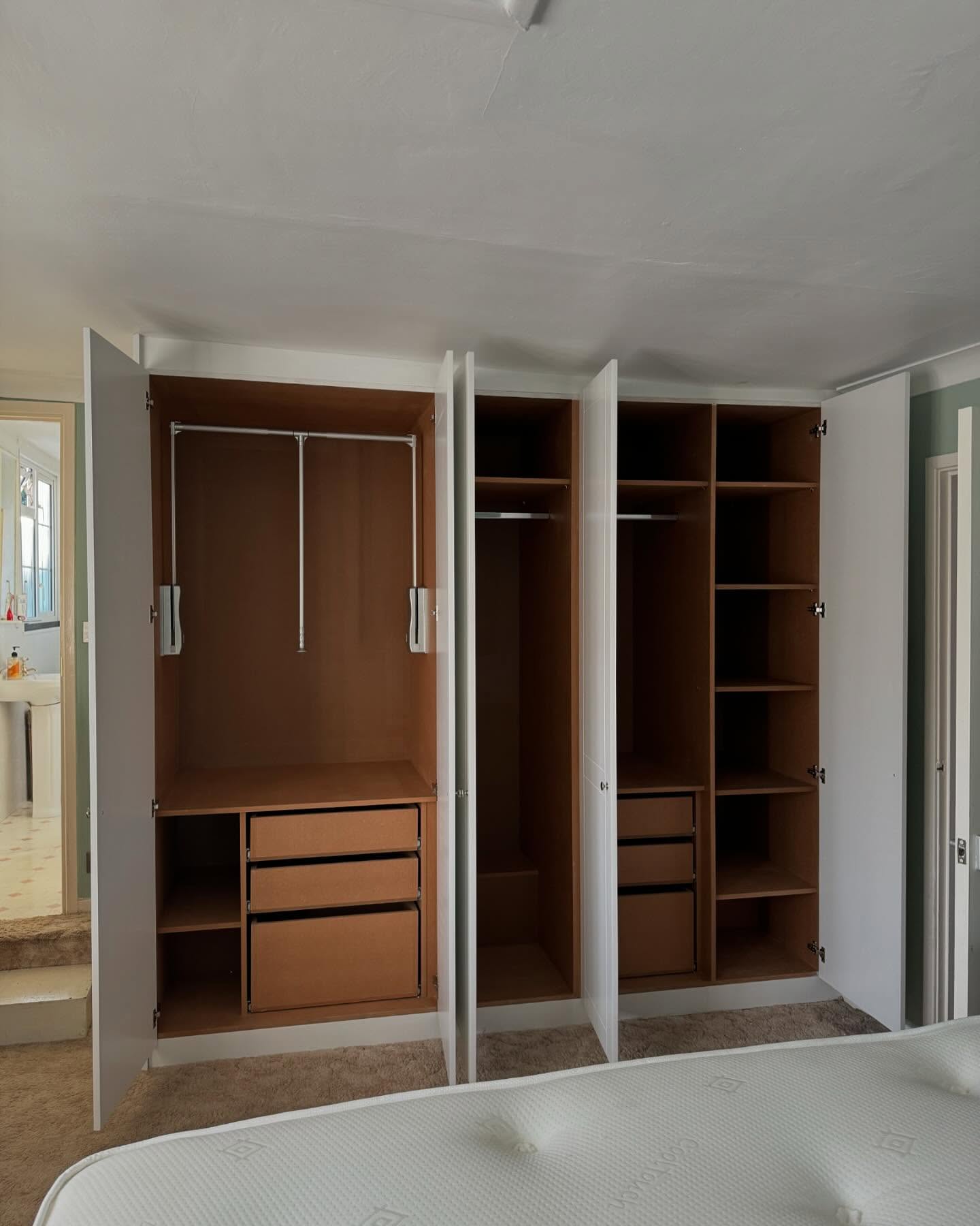 23. Geometric Precision Meets Soft Elegance: the Angular Alcove Wardrobe