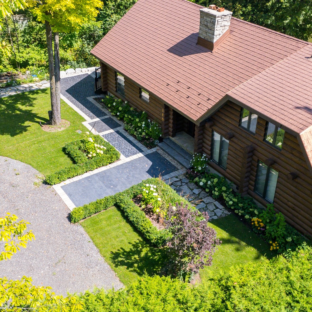 22. Moonlit Cobblestone Pathway with Lush Border Gardens