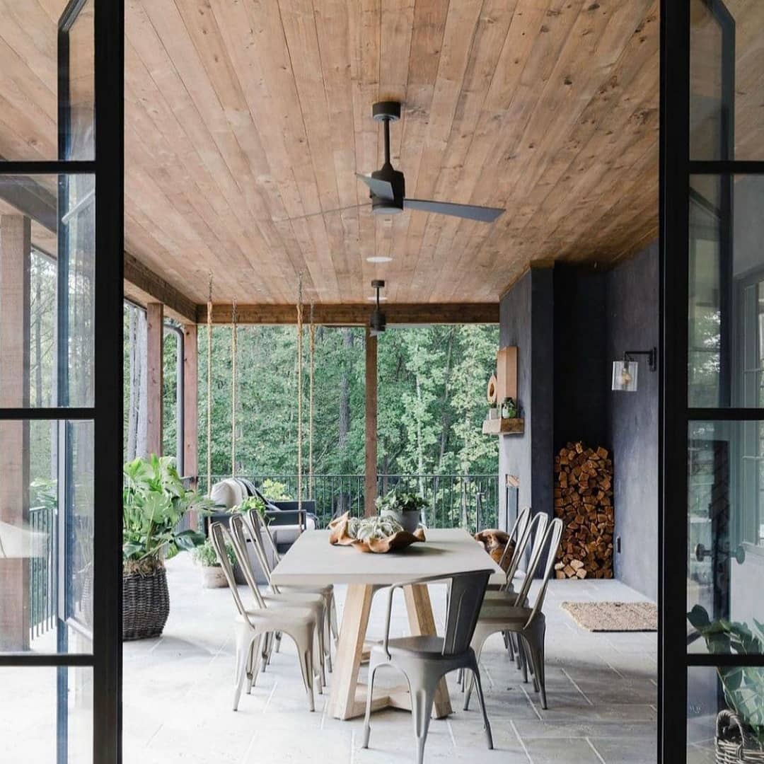 23. a Symphony Of Greenery: the Fern-lined Sunroom with Wicker Serenity