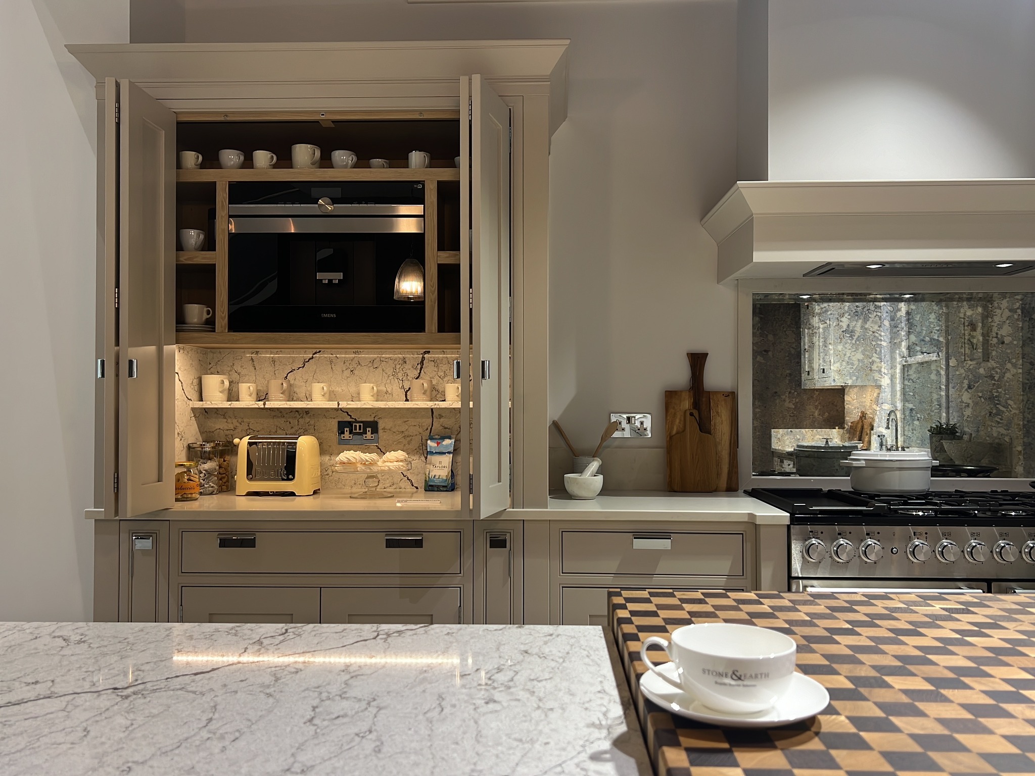 19. a Cobalt Blue Door Concealing a Chef's Wonderland with Copper Accents